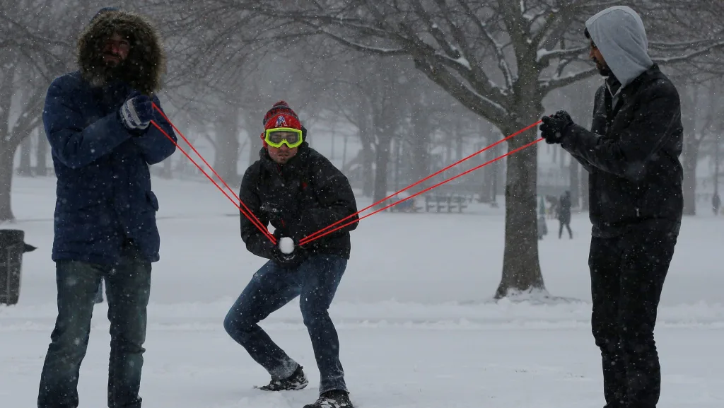 people-use-a-slingshot-during-a-snowball-fight-on-boston-common-during-a-winter-noreaster-snow-storm-in-boston