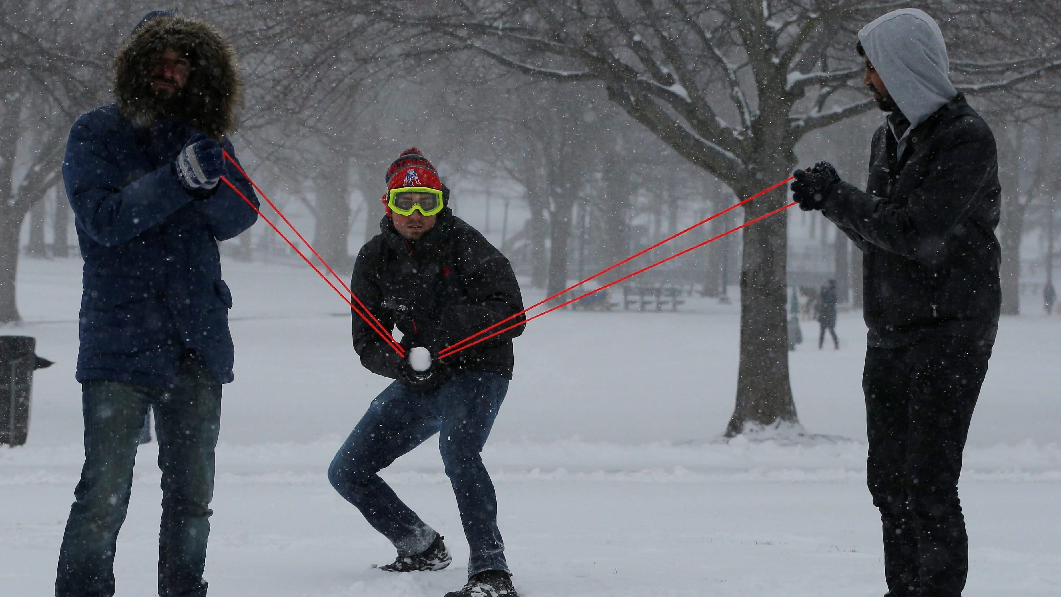 people-use-a-slingshot-during-a-snowball-fight-on-boston-common-during-a-winter-noreaster-snow-storm-in-boston