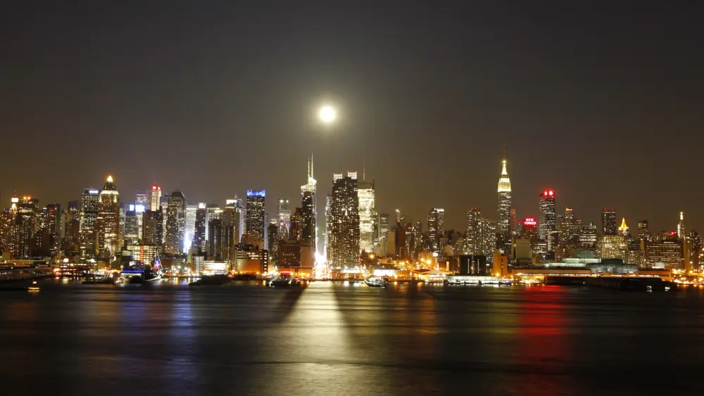 file-photo-of-a-full-moon-rising-over-the-new-york-skyline-above-42nd-street-seen-from-across-the-hudson-river-in-weehawken-new-jersey