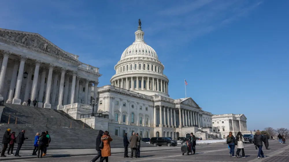 people-walk-near-the-u-s-capitol-building-in-washington-2