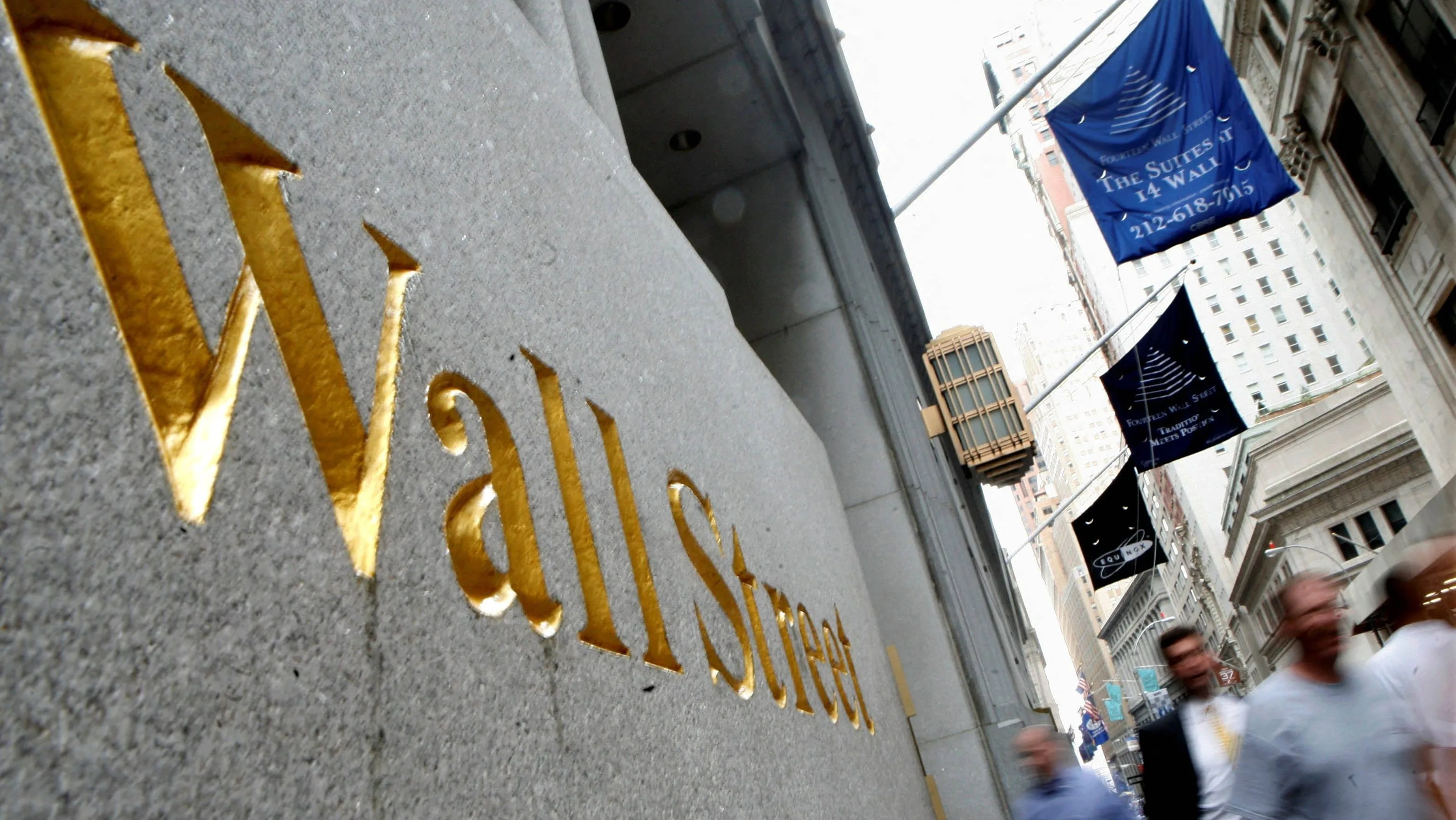 file-photo-people-walk-along-wall-street-near-new-york-stock-exchange