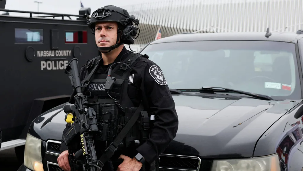 members-of-the-nassau-county-police-department-keep-watch-outside-the-nassau-veterans-memorial-coliseum-ahead-of-a-rally-held-by-trump-in-uniondale