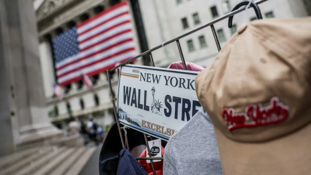 file-photo-a-wall-street-plate-is-seen-on-a-street-vendor-stall-outside-the-new-york-stock-exchange-nyse-in-new-york-city
