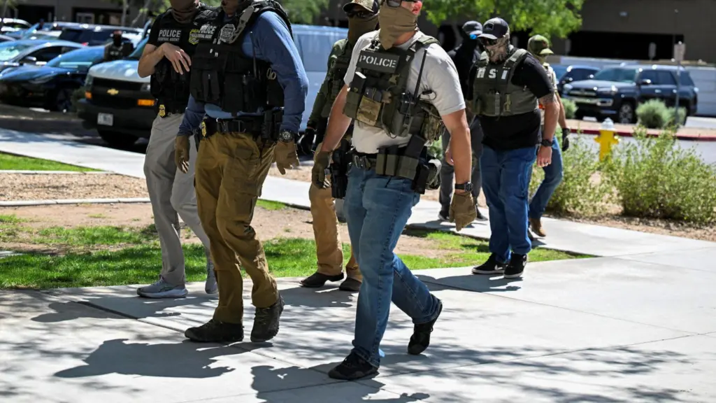 file-photo-law-enforcement-officers-including-hsi-and-ice-agents-take-people-into-custody-at-an-immigration-court-in-phoenix