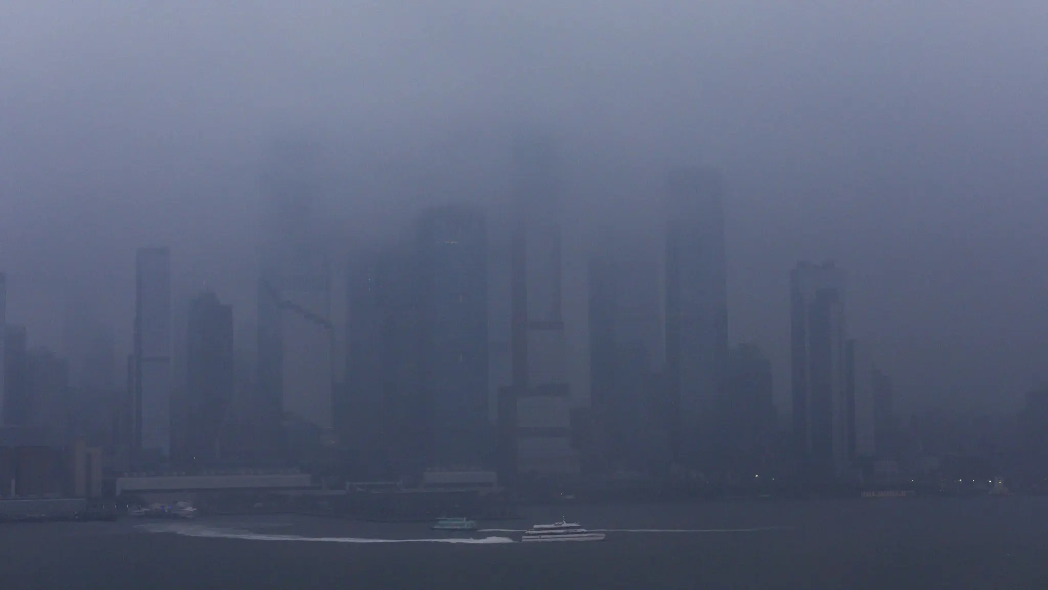 a-ferry-boat-moves-along-the-hudson-river-during-a-rain-storm-in-new-york-2