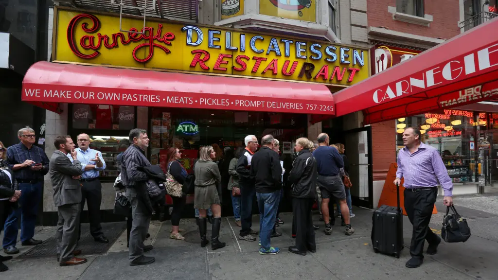 people-line-up-to-dine-at-the-famed-carnegie-deli-before-it-closes-at-the-end-of-the-year-in-the-manhattan-borough-of-new-york