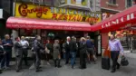 people-line-up-to-dine-at-the-famed-carnegie-deli-before-it-closes-at-the-end-of-the-year-in-the-manhattan-borough-of-new-york