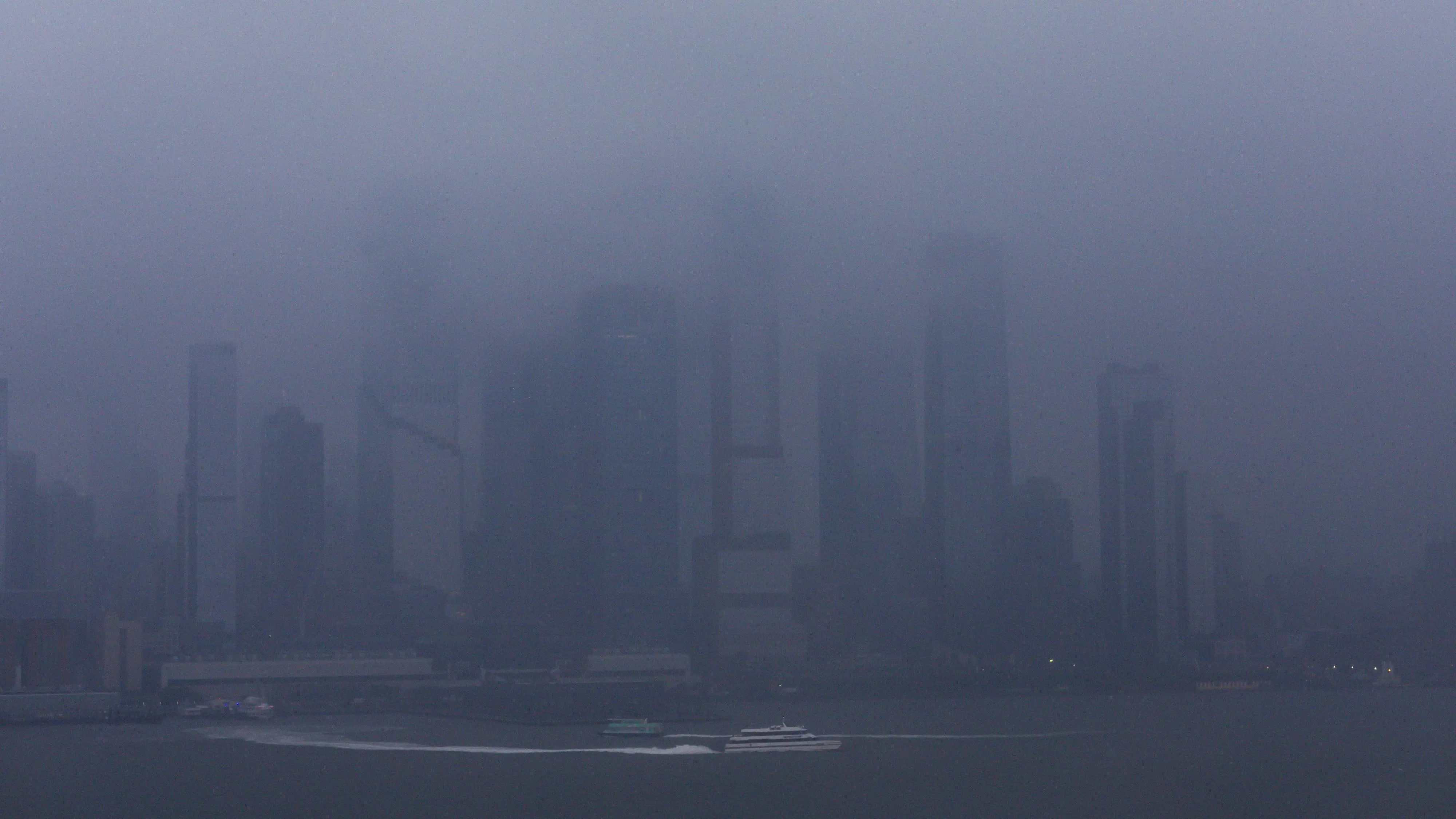 a-ferry-boat-moves-along-the-hudson-river-during-a-rain-storm-in-new-york-3