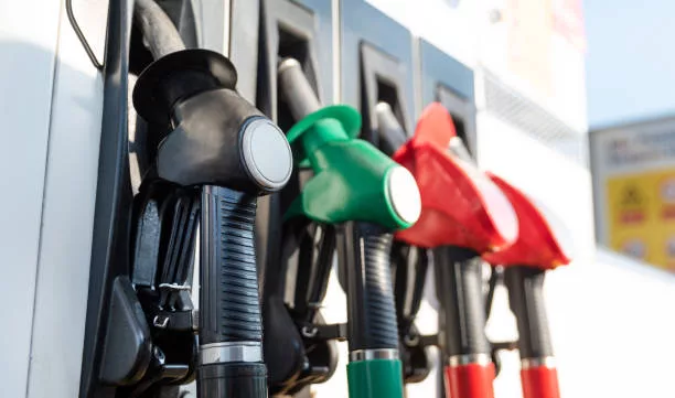 petrol-pump-filling-nozzles-fuel-at-gas-station-close-up