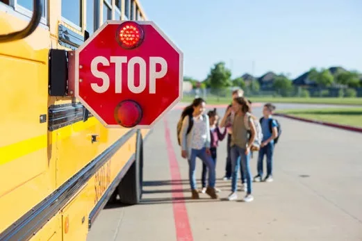 with-the-school-bus-stop-sign-out-and-lit-the-children-feel-safe-to-walk