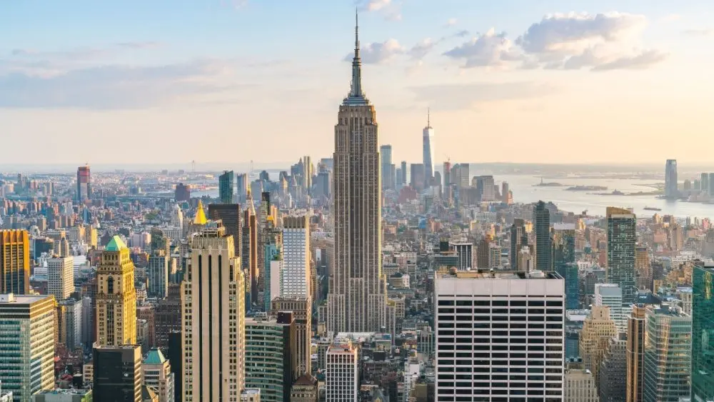 A stunning view of New York City^ showcasing iconic landmarks with the Empire State Building as its centerpiece