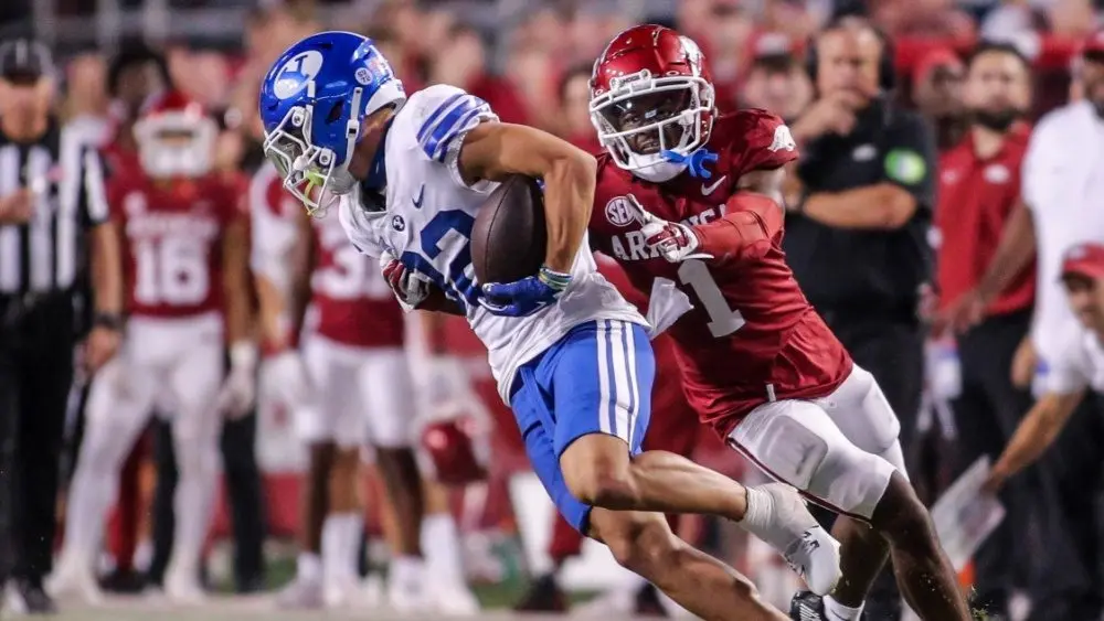 NCAA Football^ BYU 38:31 Ark- Cougars WR Parker Kingston (82) catches a pass fights off Razorbacks DB Lorando Johnson (1) the game at Razorback Stadium^ Fayetteville^ AR. Sept 16^ 2023
