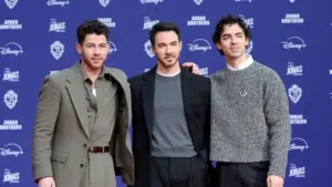 Nick Jonas^ Kevin Jonas^ Joe Jonas at Jonas Brothers Hand And Footprint In Cement Ceremony at the TCL Chinese Theater IMAX on December 3^ 2025 in Los Angeles^ CA