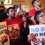 Demonstrators protest SB 4^ an anti-Sanctuary Cities immigration law^ under the dome of the state Capitol in Austin^ Texas^ USA - May 29^ 2017