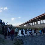 Migrants from Venezuela cross the Rio Grande to surrender to the border patrol with the intention of requesting asylum in the United States.