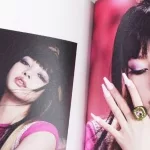 BlackPink BORN PINK 2nd Album photobook with Lisa on grey. South Korean girl group BlackPink.