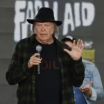 Neil Young talks onstage at the 2018 Farm Aid press conference. Hartford^ CT - September 22^ 2018