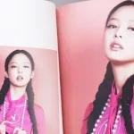 BlackPink BORN PINK 2nd Album photobook with Jennie on grey. Pink music CD in player.