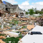 Debris from destroyed homes and property is strewn across areas of St. Louis^ Missouri after tornadoes hit the Saint Louis area on Friday^ April 22^ 2011.