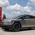 Tesla Cybertruck display at a dealership. Tesla claims the Cybertruck has a driving range of up to 340 miles. Indianapolis - May 19^ 2024: