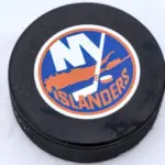 New York Islanders logo on Ice hockey puck outdoors in snow OREBRO^ SWEDEN - FEBRUARY 3^ 2019