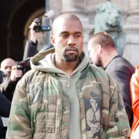 Kanye West iin front of the Dries van noten fashion show. Paris Hotel de ville.