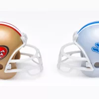 Football helmets of the San Francisco 49ers and Detroit Lions