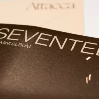 Seventeen's 9th Mini Album^ "Attacca"was released in 2021. Seventeen is a South Korean K-Pop group under Pledis andHYBE. Album cover pictured.