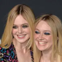 Elle Fanning & Dakota Fanning arriving at the Saint Laurent at the Palladium fashion show at the Hollywood Palladium. LOS ANGELES^ CA - FEBRUARY 10^ 2016