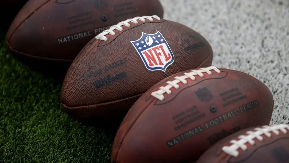 NLF footballs are displayed before an NFL football game between the Los Angeles Rams and the Seattle Seahawks at SoFi Stadium Sunday Nov. 16^ 2025^ in Inglewood^ Calif.