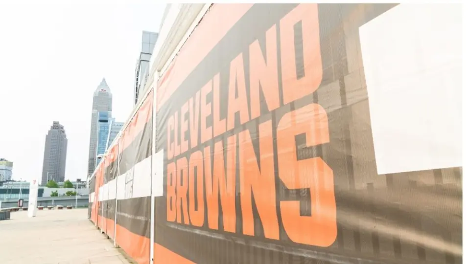 Cleveland Brown's Banner Closeup Leading To The Structural Cityscape Skyline Of Downtown Cleveland. Cleveland^ Ohio/USA - June 1^ 2019