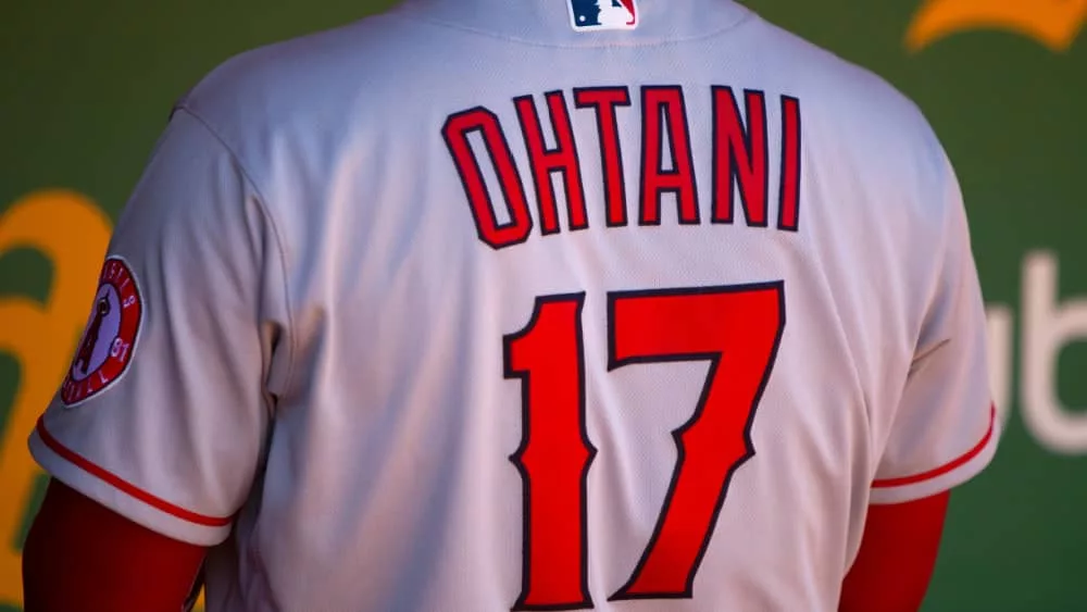 Shohei Ohtani of the Los Angeles Angels in the dugout at the Oakland Coliseum. August 10^ 2022: