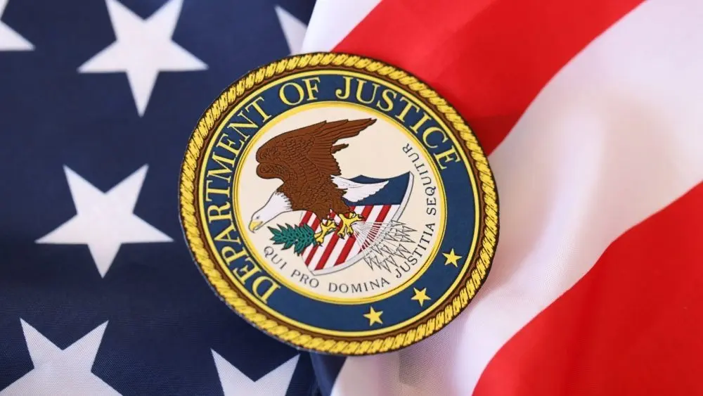 US Department of Justice seal on United States of America flag close up