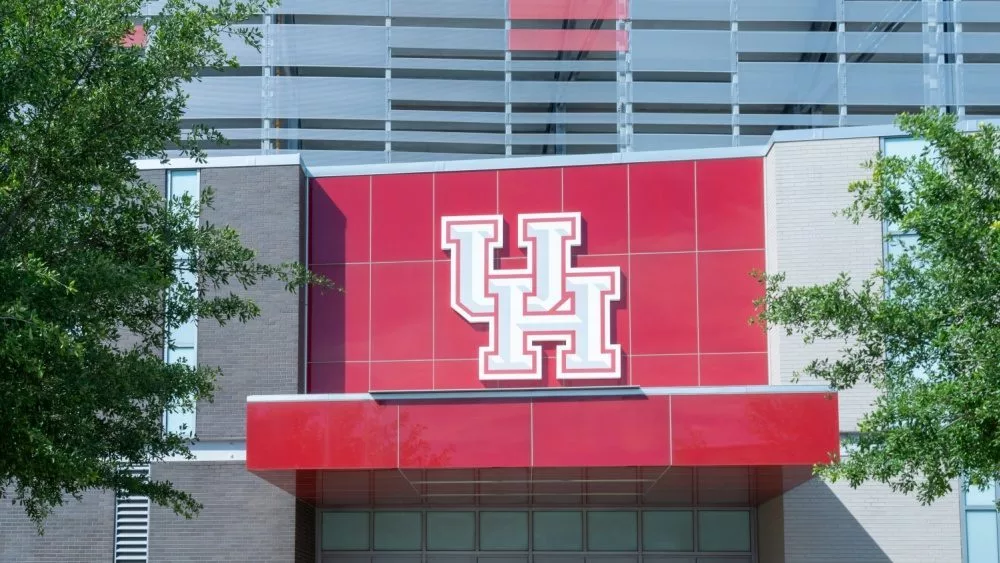 UH (University of Houston) logo sign on the building at TDECU Stadium in Houston^ Texas^ USA. Houston^ Texas^ USA - April 5^ 2024