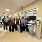 SSM Health Good Samaritan Hospital team members from the emergency department, auxiliary, and foundation with one of the new workstations on wheels. (Photo credit: SSM Health)
