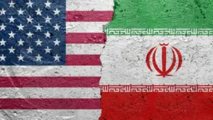 United States of America vs Iran - Cracked concrete wall painted with a USA flag on the left and a Iranian flag on the right