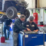 PowerSports Instructor Ralph Boots works with a student during a hands-on lab session in Southeastern Illinois College’s PowerSports Technology program. Students in the program receive practical training in the maintenance and repair of ATVs, UTVs and other recreational vehicles. (Photo credit: SIC)