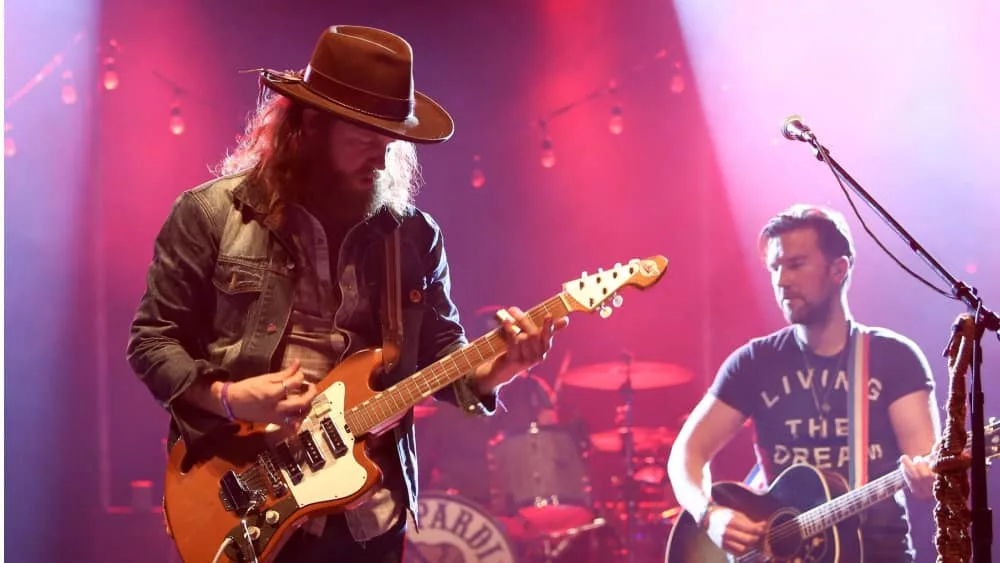 Singers T.J. Osborne (R) and John Osborne of Brothers Osborne perform onstage at the Paramount on May 6^ 2016 in Huntington^ New York.