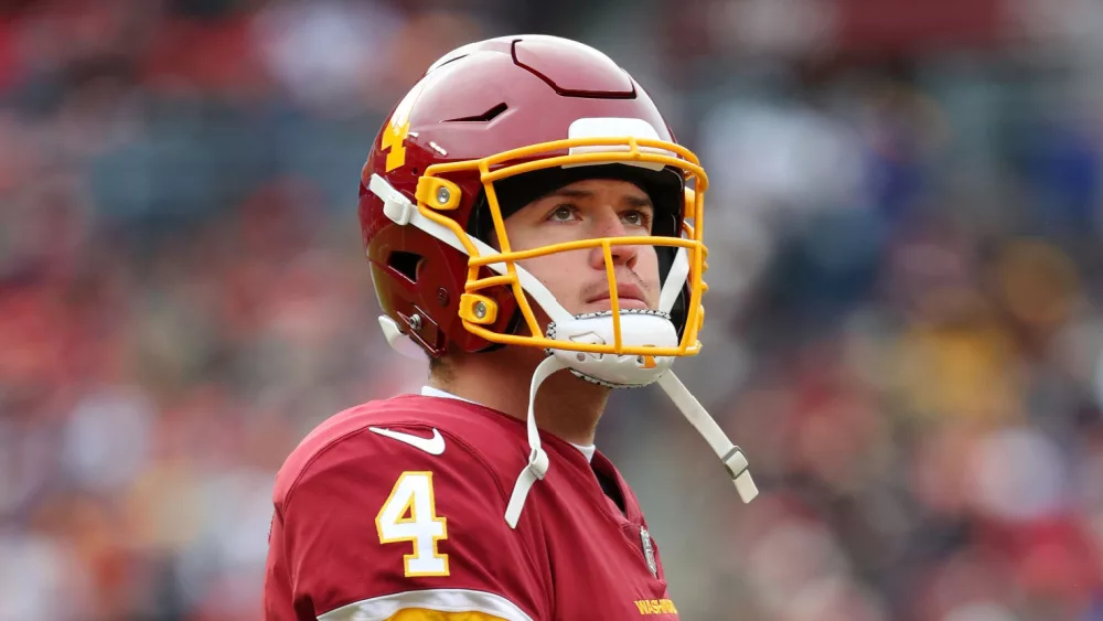 Quarterback Taylor Heinicke (4) at NFL game at FedEx Field on Nov 14^ 2021 in Landover^ MD