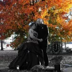 Melissa Jones: My husband & I met at as actors at a Haunted house in Salem. I was a dead Southern Belle & he was the Grim Reaper. I like to joke I got the "kiss of death" and survived! Our 1st six weeks of dates was Halloween-centered: haunted theme parks, the movie Zombieland, and a visit to Waverly Hills TB Sanitorium in Louisville, KY. On 10/31/11 he proposed to me at a costume party at Waverly Hills, and we were married 10/13/12 in a Halloween-themed wedding. We'll be celebrating our 12th anniversary this year!