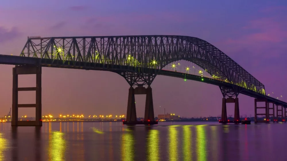 Francis Scott Key bridge with Baltimore skyline at night