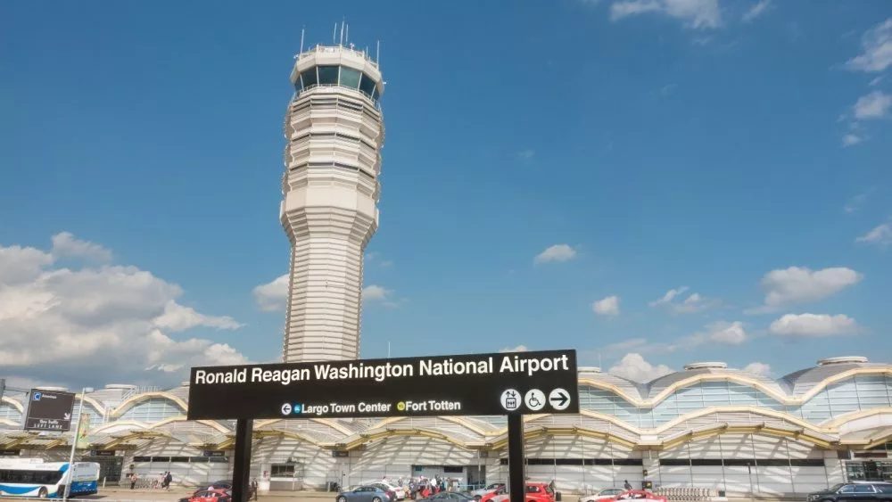 Control Tower^ National Airport seen from Metro Station platform. Ronald Reagan National Airport^ aka DCA^ is actually in Arlington^ three miles from DC. ARLINGTON^ VIRGINIA - OCT. 12^ 2017