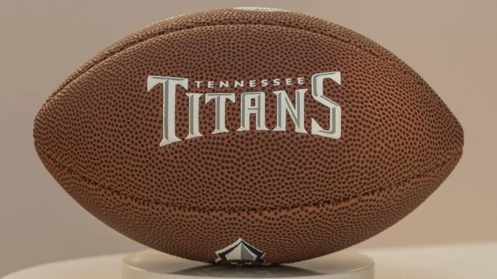 Tennessee Titans football on white stand.