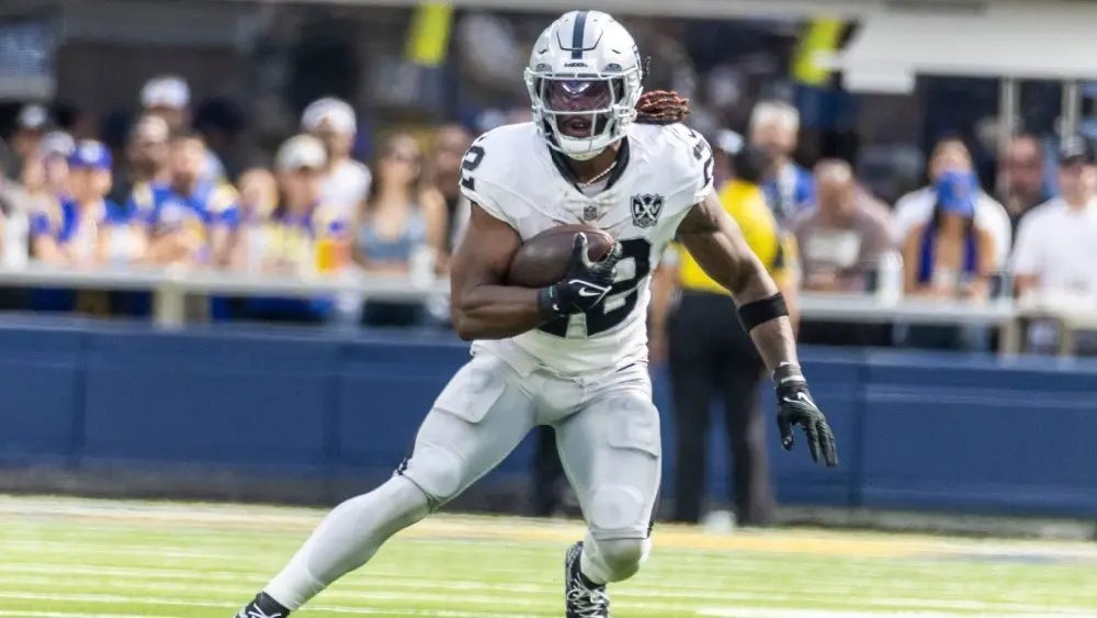 Las Vegas Raiders running back Alexander Mattison #22 runs the ball against the Los Angeles Rams in an NFL football game at SoFi Stadium^ Oct. 20^ 2024^ in Inglewood^ Calif.