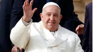 Pope Francis waves to the faithful at the end of his weekly general audience in St. PeterÕs Square at the Vatican^ November 13^ 2024.