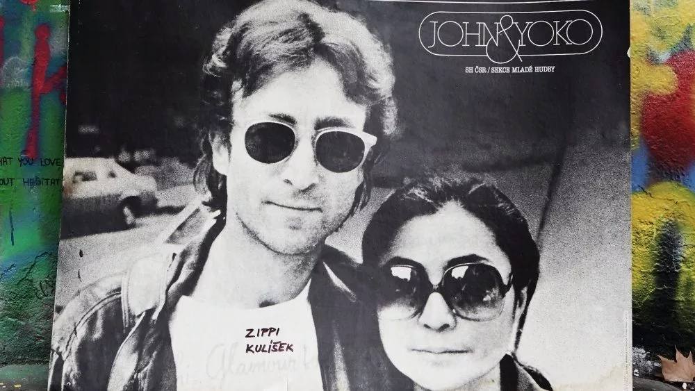 The Lennon Wall since the 1980s is filled with John Lennon-inspired graffiti and pieces of lyrics from Beatles. PRAGUE^ CZECH REPUBLIC - DECEMBER 15