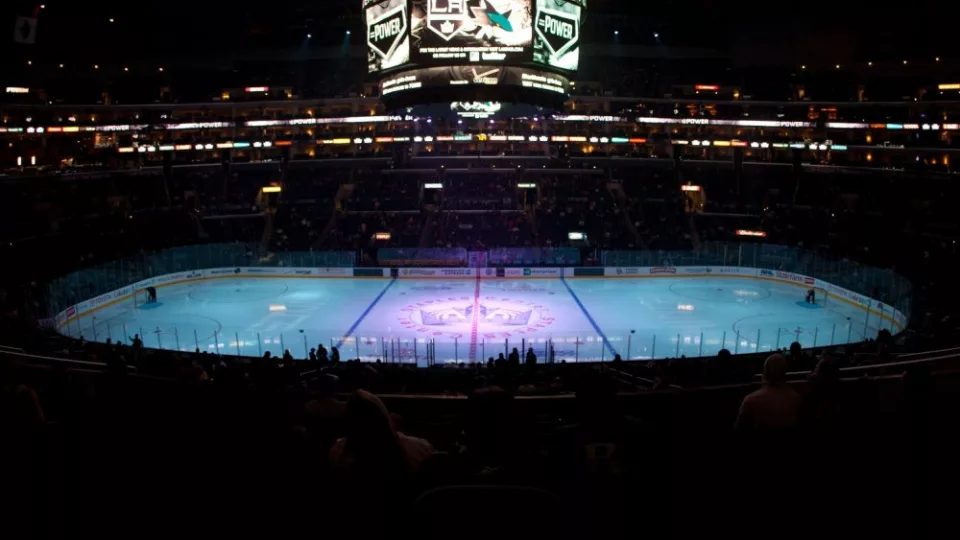 pro ice hokey rink lit up at nighttime