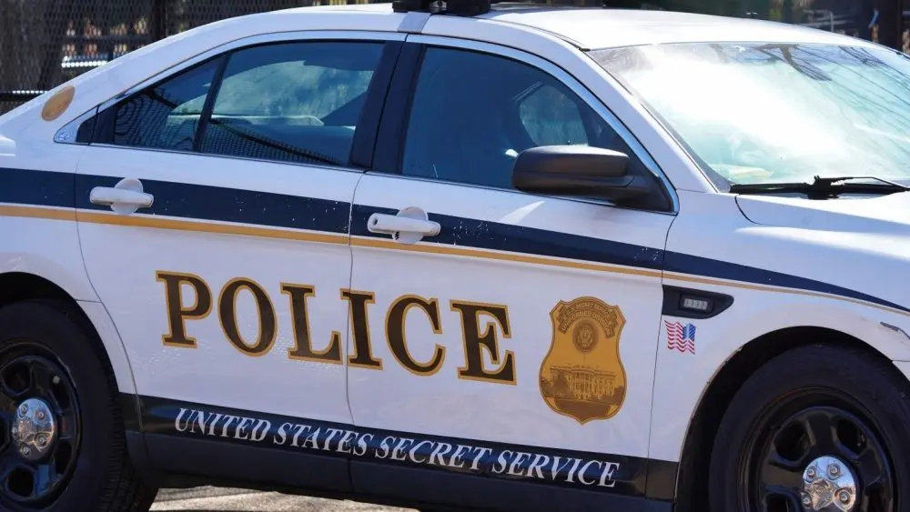 A United States Secret Service Police Car parked outside an entrance to the White House. Washington DC - February 23^ 2025