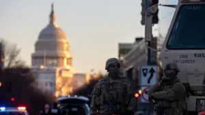 Members of the National Guard patrol the area surrounding the outskirts of the Capitol Building on January 19^ 2021^ in Washington D.C.