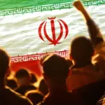 Defocus protest in Iran. Conflict war over border. World crisis. Country flag. Woman low rights. Male hands. Out of focus.